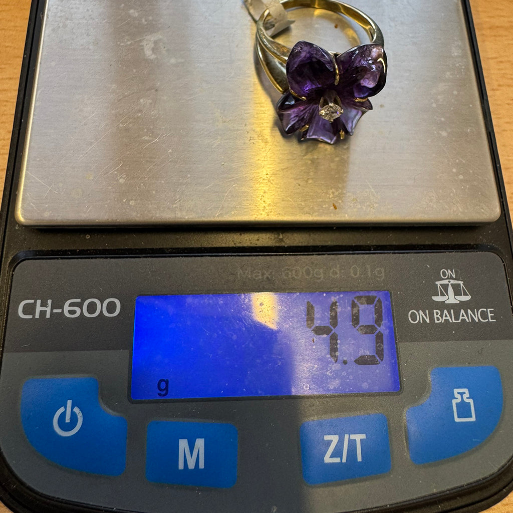 Diamond and carved Amethyst ring