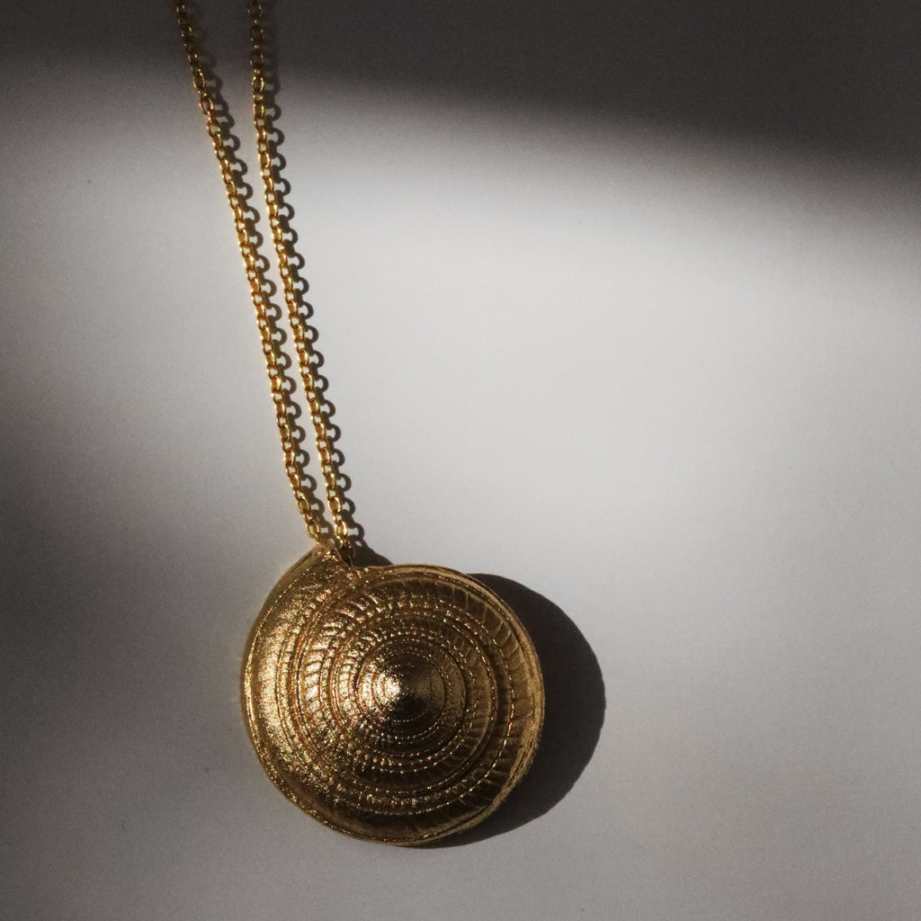 A Gold-Plated Shell Pendant